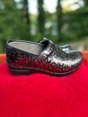Dansko Metallic Black Rose-Embossed Clog